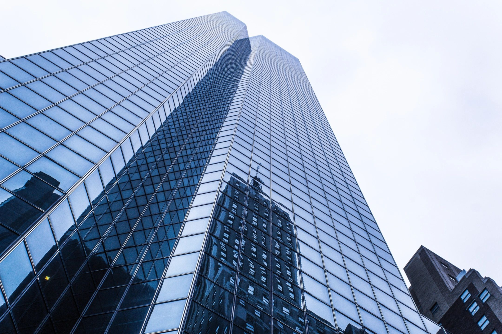 A tall building with many windows in the sky